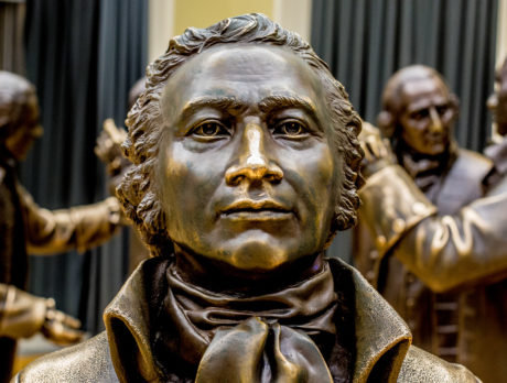 An up close image of bronze statue of Alexander Hamilton in the Signer's Hall exhibit at the National Constitution Center.