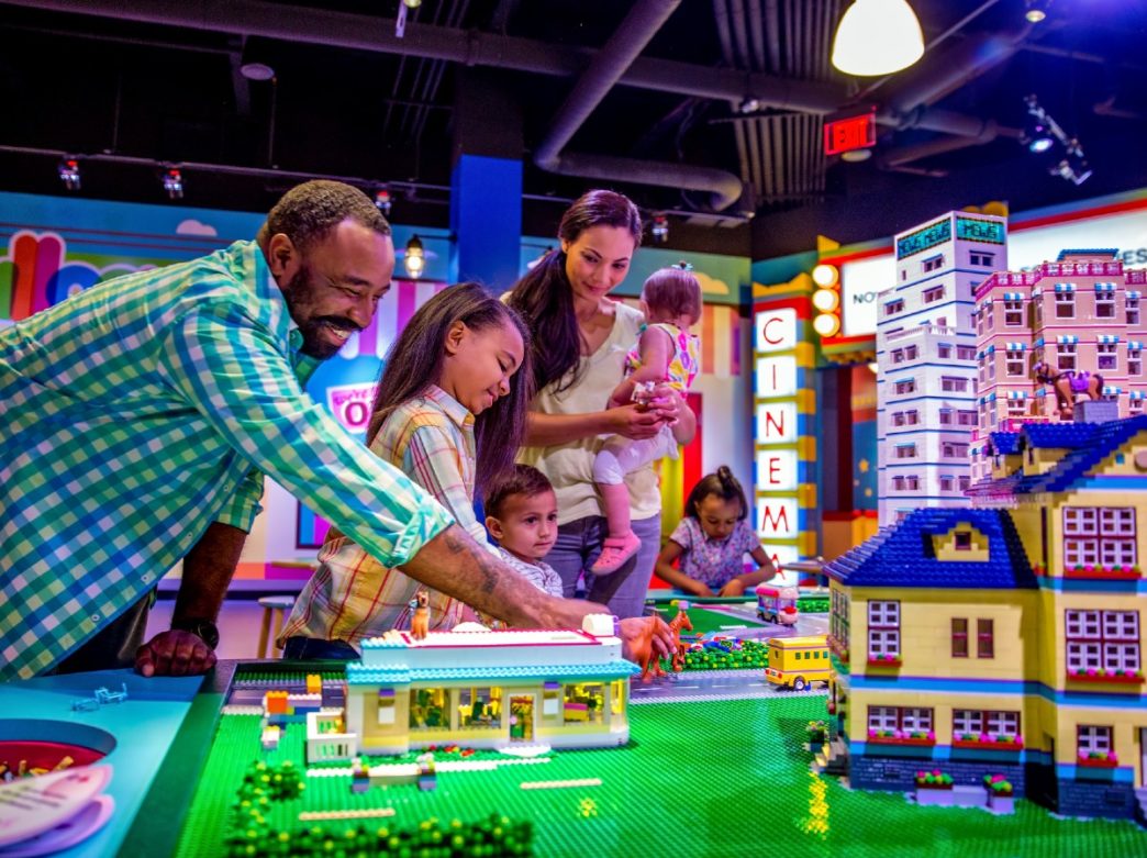 A family playing with legos at LEGOLAND Discovery Center