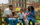 A family of five enjoys cups of water ice on a bench in Washington Square