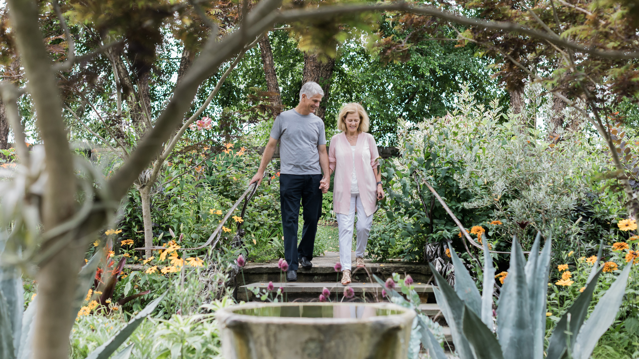 A couple walking through Chanticleer Garden
