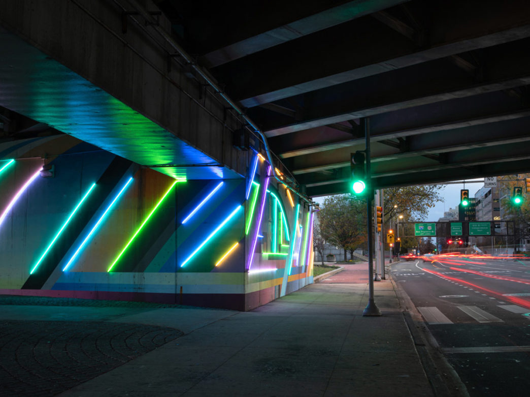 Colorful neon tubes light up an overpass in Philadelphia's Historic District