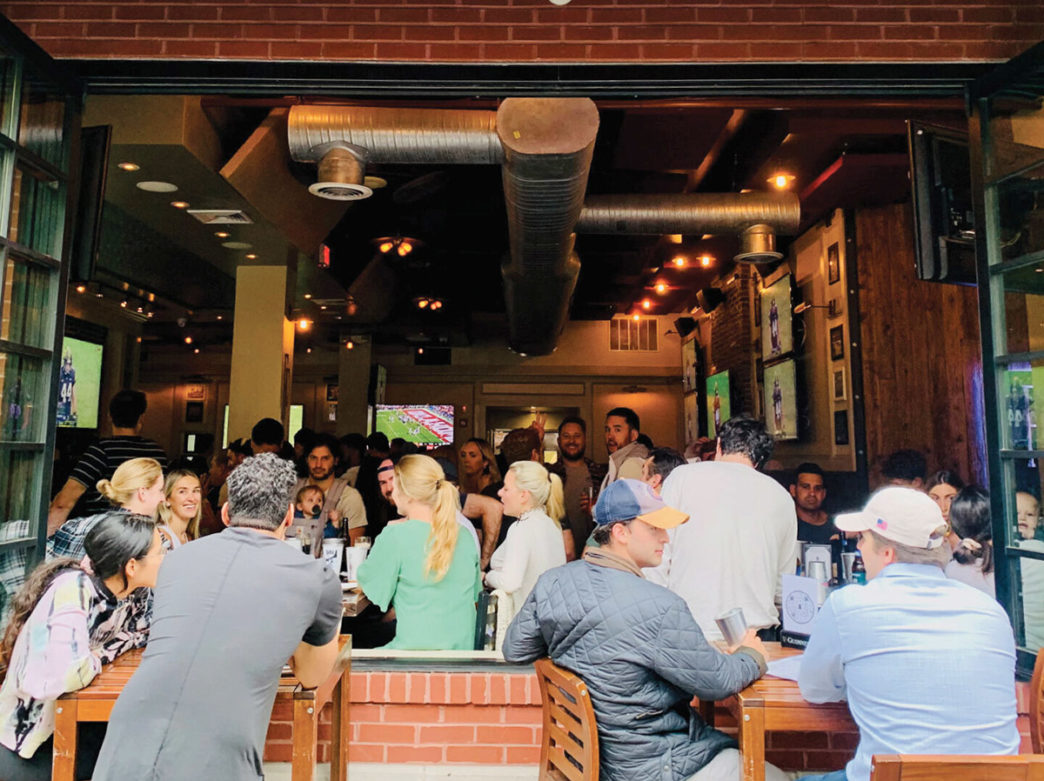 People gather inside and out at FOunding Fathers in Philadelphia