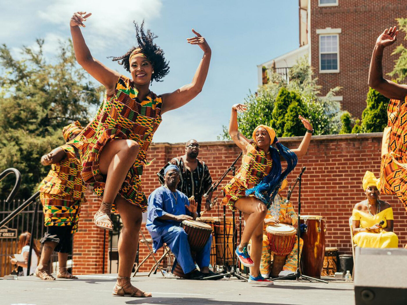 Performers dancing on stage at the Odunde Festival in Philadelphia