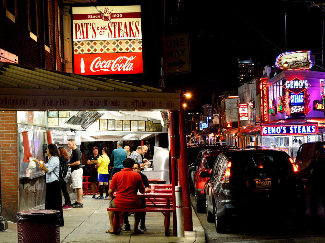 Pat's Steaks and Geno's at night