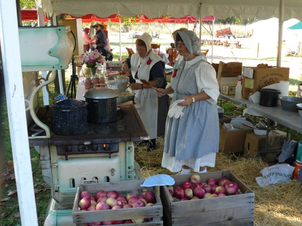 Women making cider at the Apple Butter Frolic