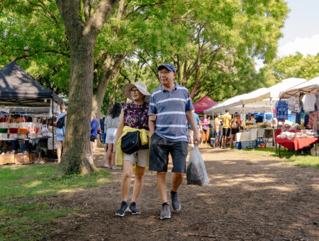 A couple strolls through the Southeast Asian Market in Philadelphia on a summer day.