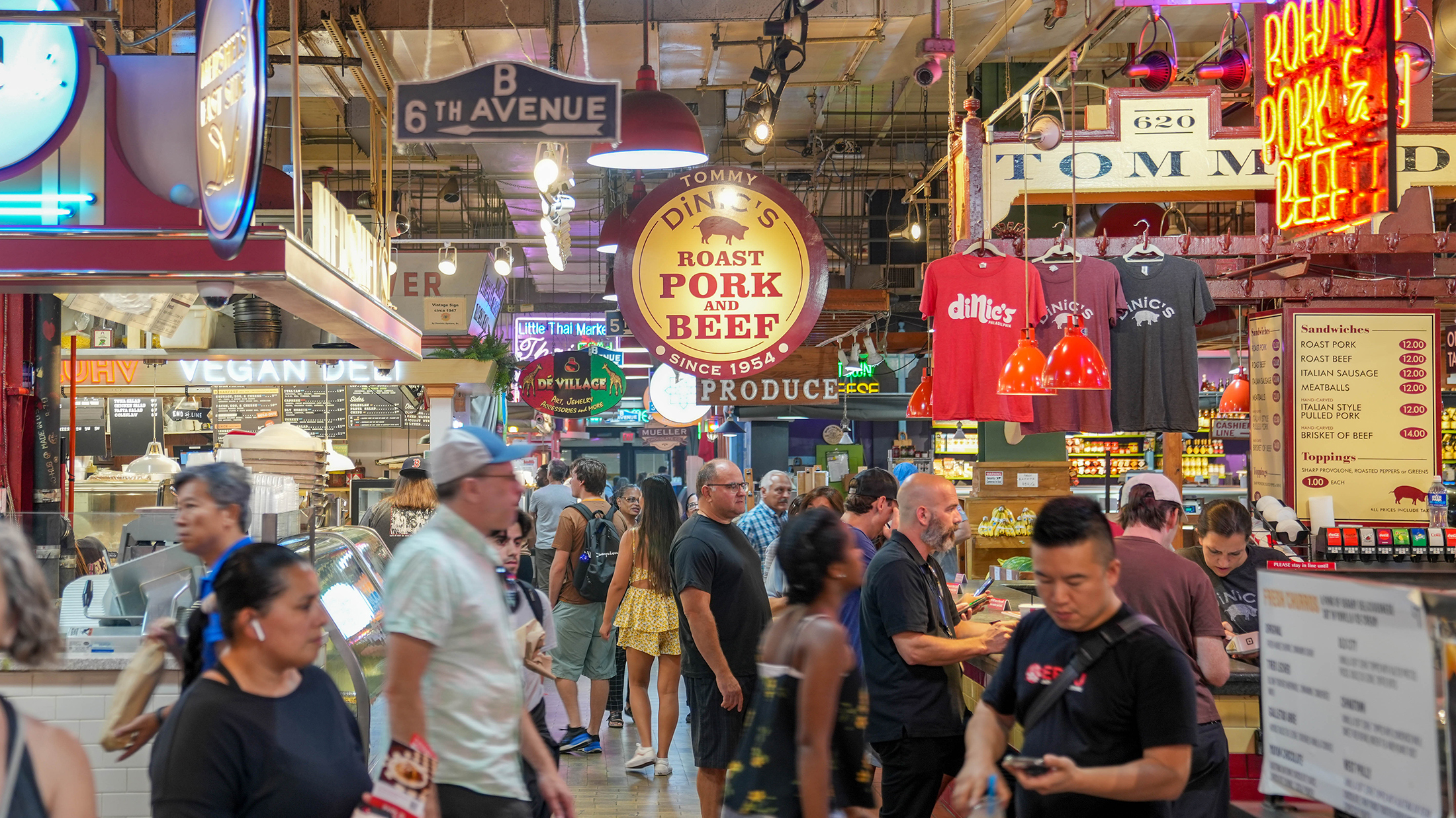 People walk through Reading Terminal Market near DiNic's counter.