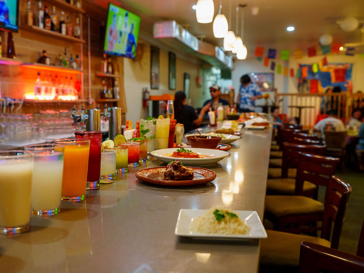 The bar at Casa Mexico in South Philadelphia with people dining in the background