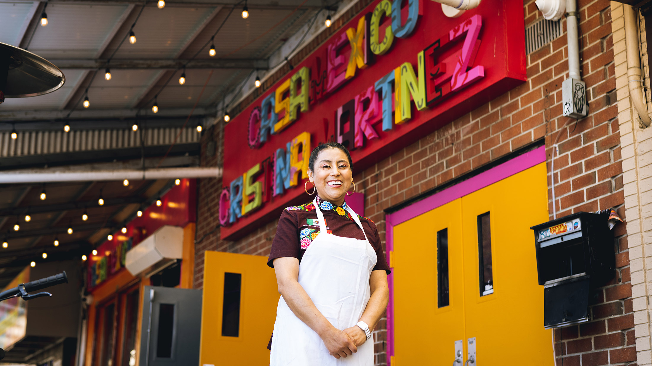 Chef Cristina Martinez standing in front of Casa Mexico in South Philadelphia
