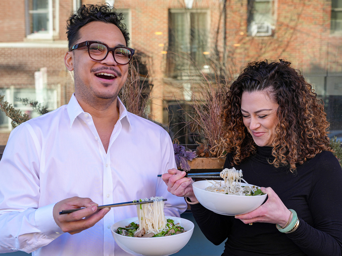 Chef Phila and wife Rachel each enjoy a bowl of Cambodian noodles at Mawn in Philadelphia.
